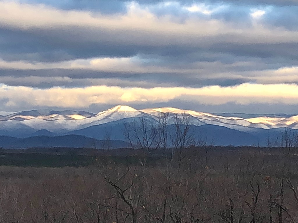 Snow-capped Blue Ridge peaks at sunset from the grounds