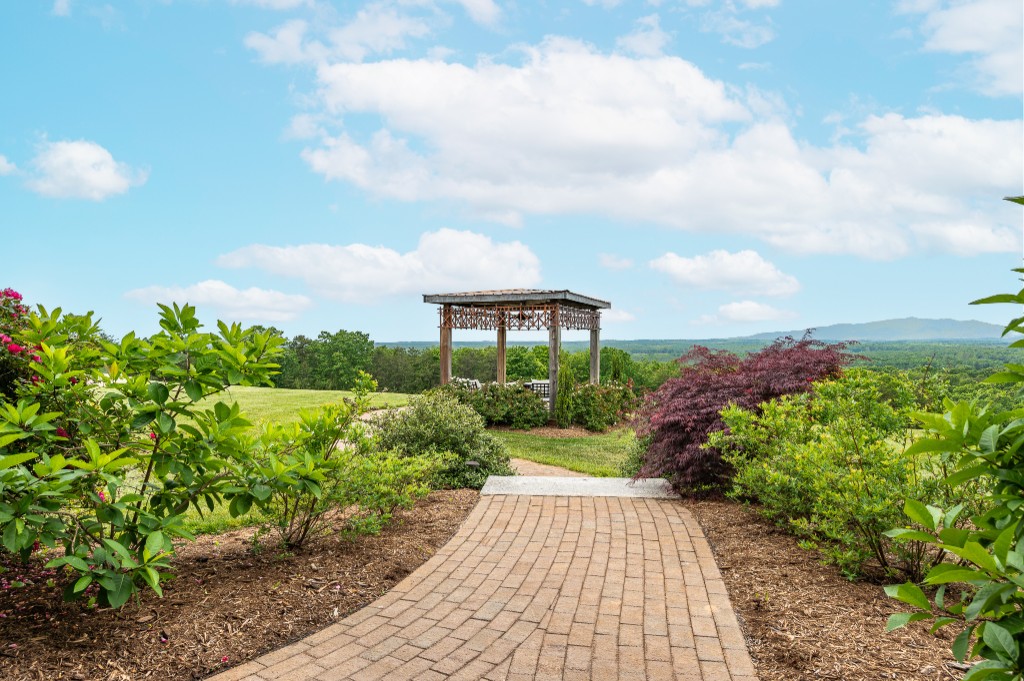 Brick walkway to the gazebo with valley and mountain views