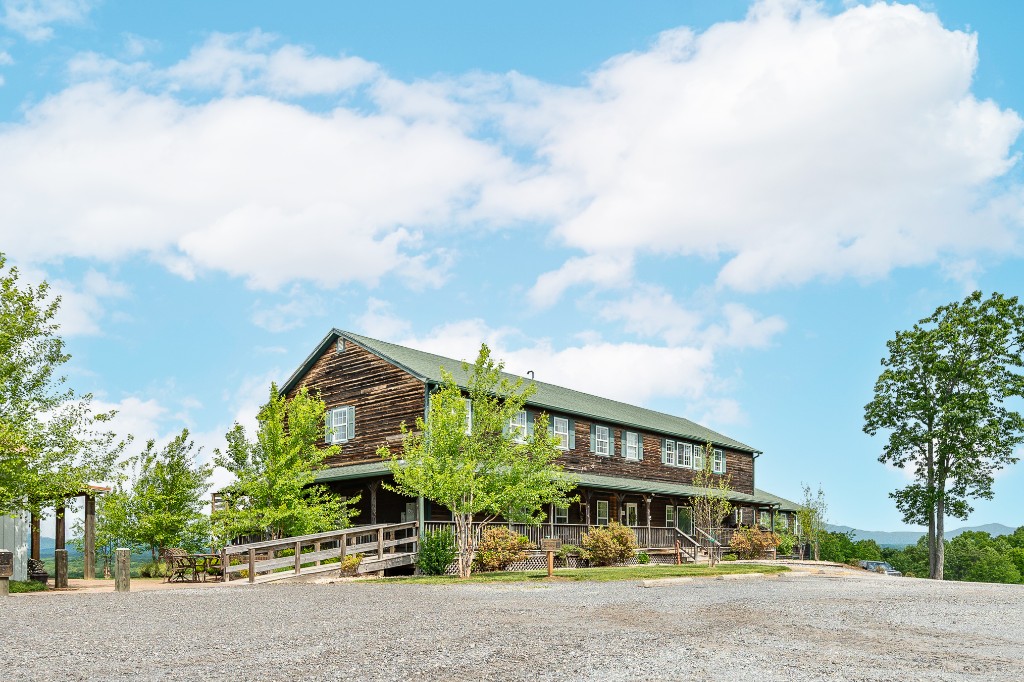 Belle View main lodge with covered porch, accessibility ramp, and Blue Ridge views