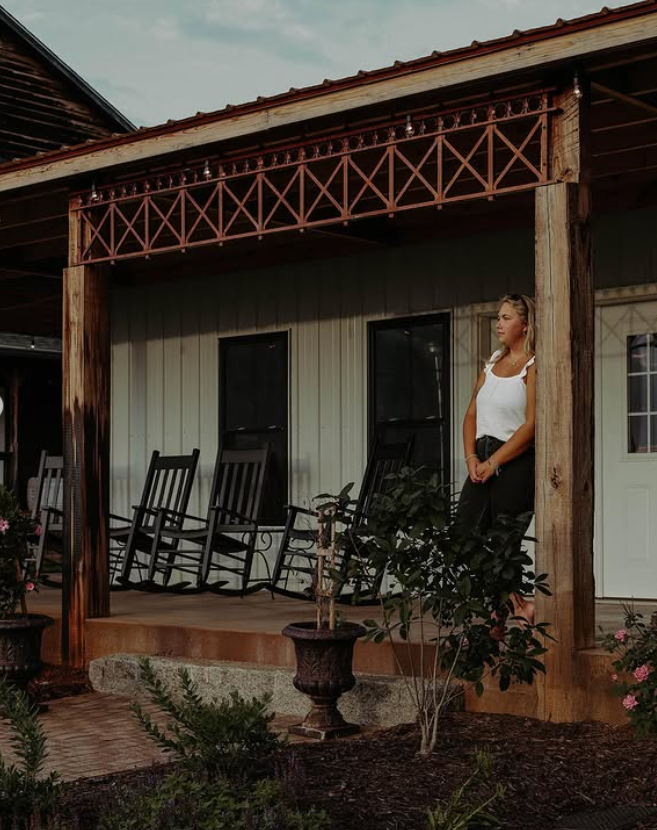 Covered porch with rocking chairs at Belle View