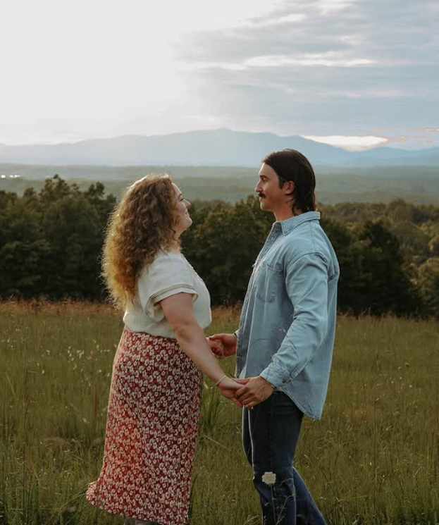 Couple on the grounds with Blue Ridge views at Belle View