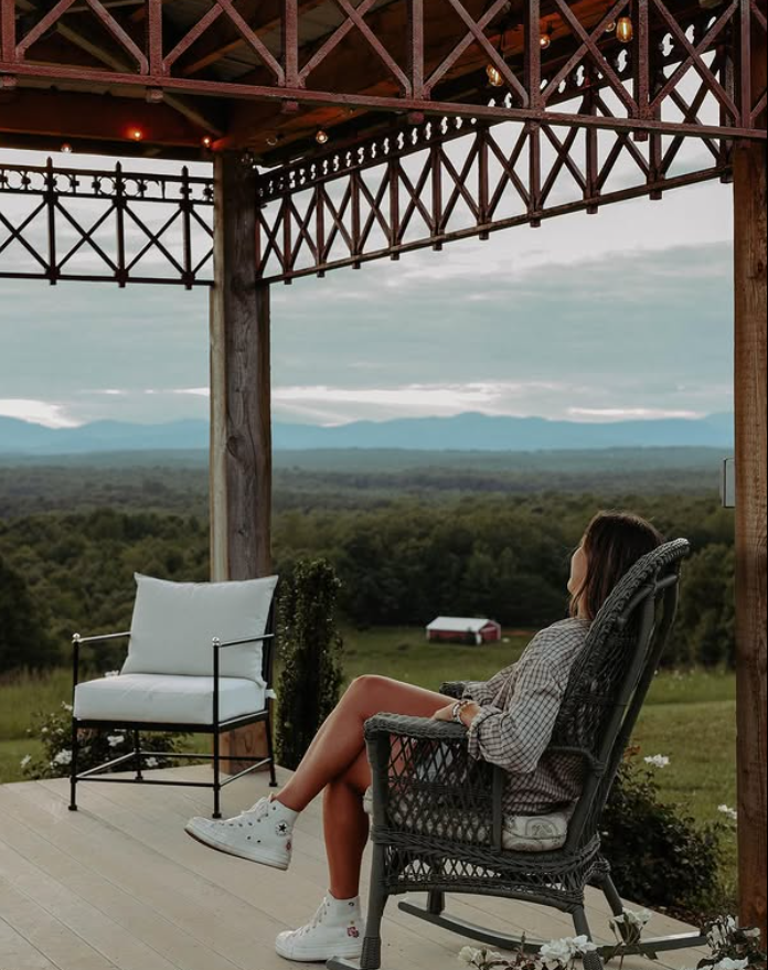 Guest enjoying the Blue Ridge vista from the porch
