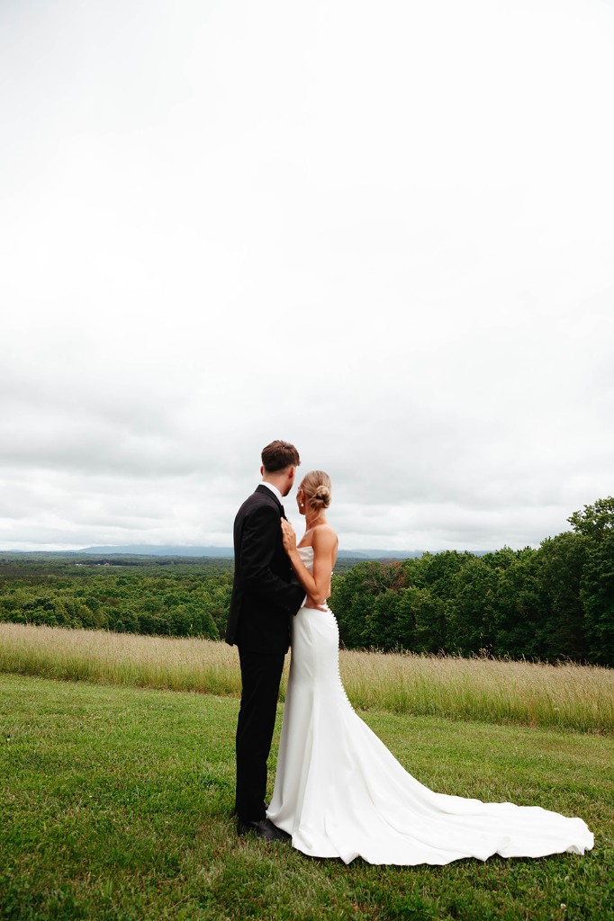 Bride and groom overlooking the estate grounds and Blue Ridge
