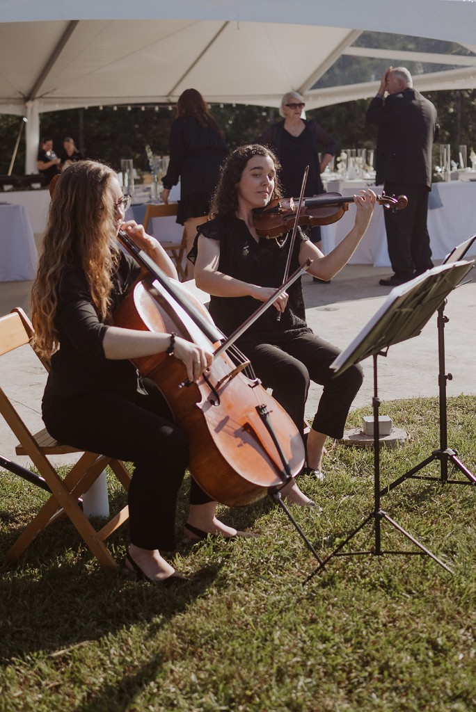 Live string music for an outdoor reception