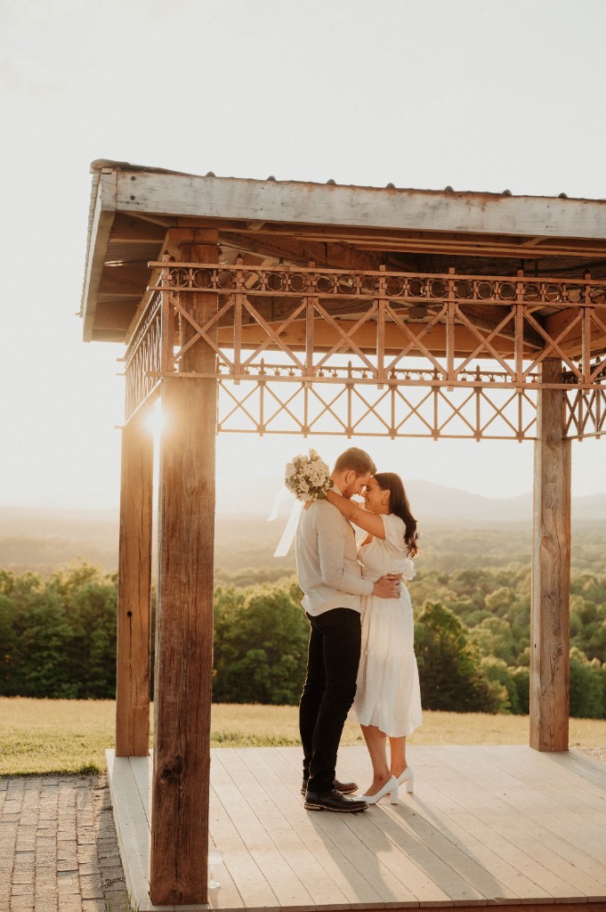 Couple under the pavilion at golden hour
