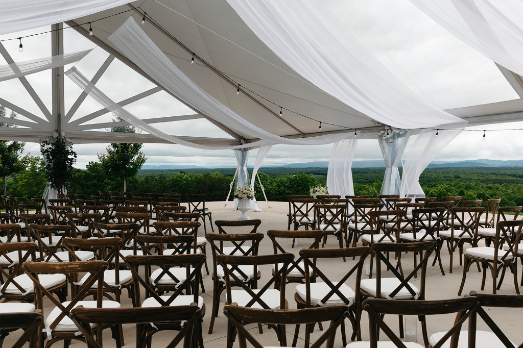 Wedding ceremony seating under tent with Blue Ridge mountain views